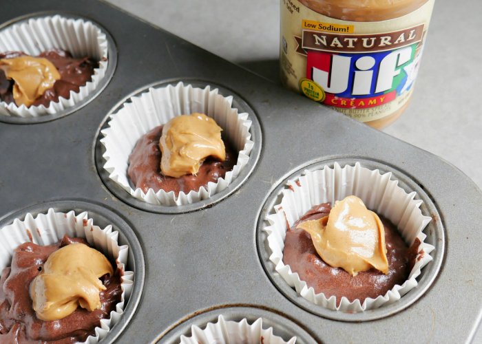 chocolate cupcakes in pan with peanut butter